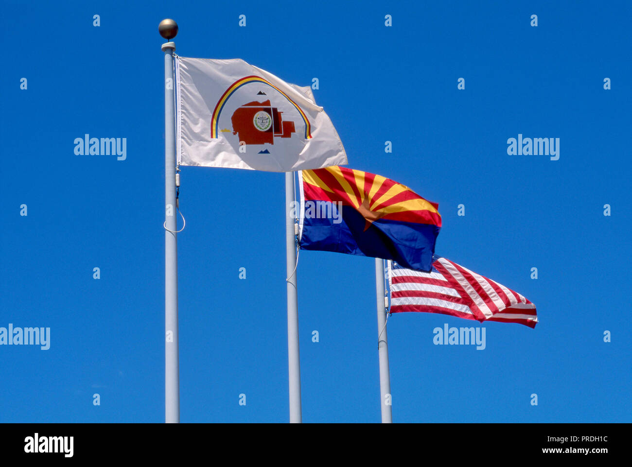 Flags of Navajo Nation, State of Arizona, and US, Canyon de Chelly, Arizona. Photograph Stock Photo