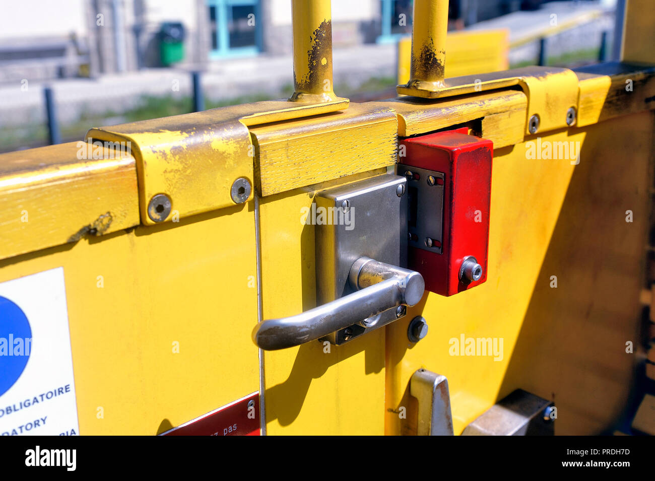 Door opening system of the little yellow train in close-up Stock Photo