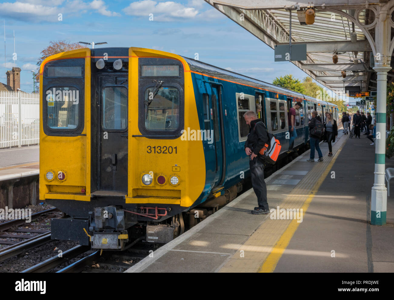 Class 313 Electric Multiple Unit Train In The Platform On The Southern class-313-electric-multiple-unit-train-in-the-platform-on-the-southern