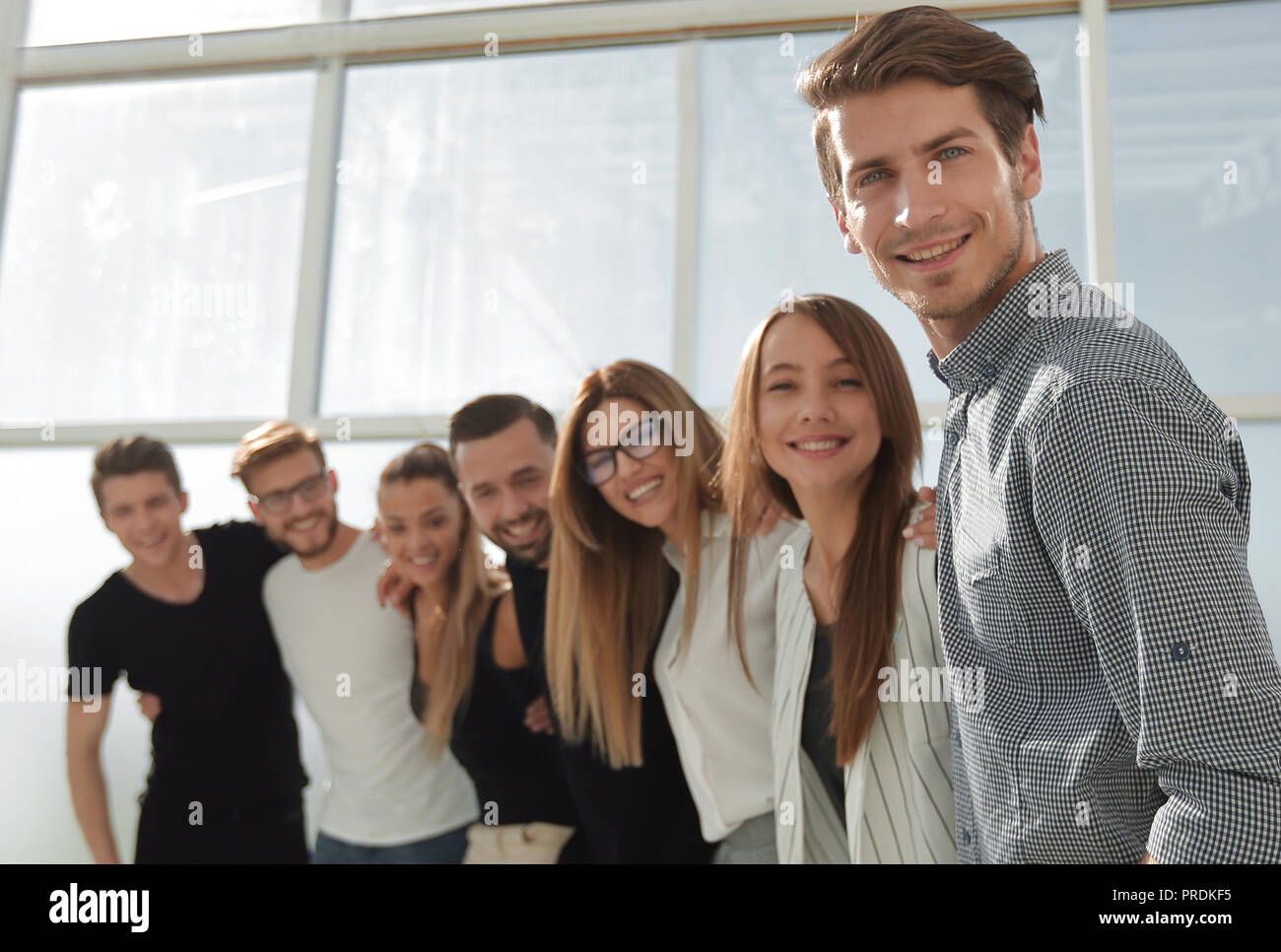 group of successful young people standing in the office Stock Photo - Alamy
