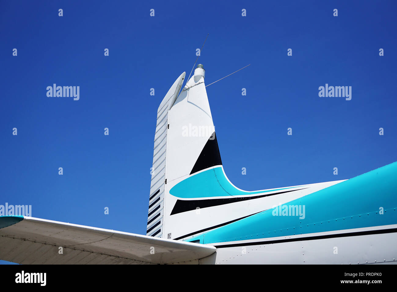 Tail of an Airplane against the Blue Sky. Airplane on the Backgroud Blue Sky with Blue Sky view. Stock Photo