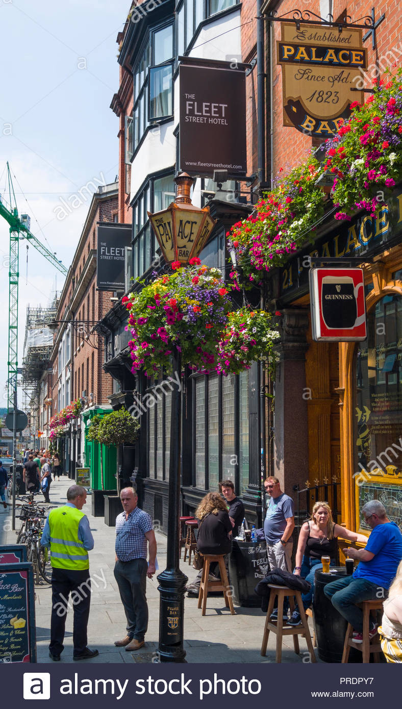 Colorful Flowers In Hanging Baskets Decorate The Entrance To The