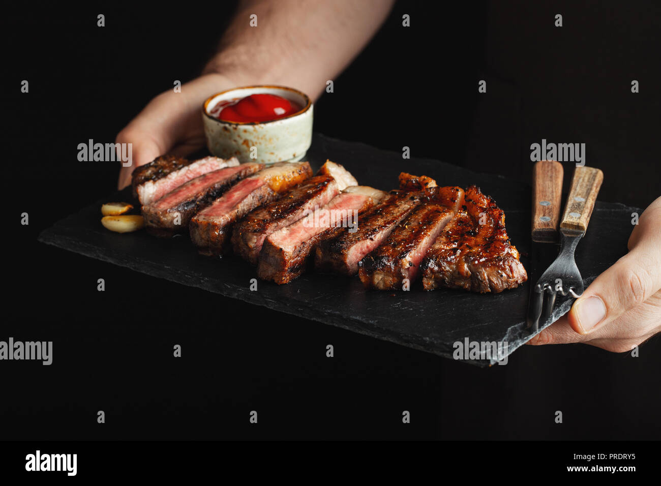 Black man cooking on a barbecue hires stock photography and images Alamy