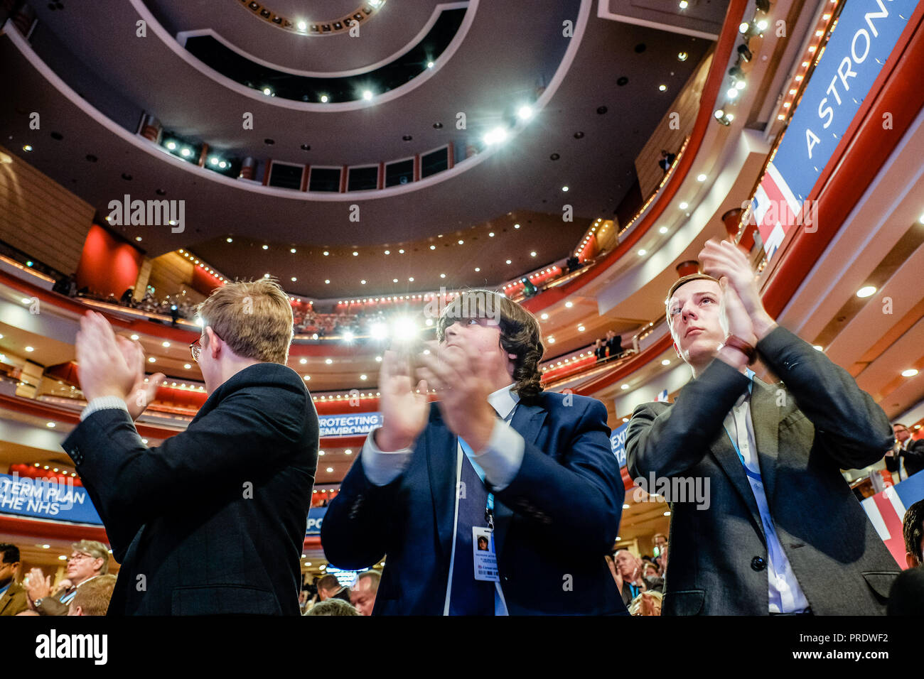 Birmingham, UK. 1st Oct 2018. Young Conservatives rise to their feet and appluad as Dominic Raab, Secretary of State for Exiting the European Union, mentions the problems with Anti-Semitisim in the Labour Party during his speech at Conservative Party Conference on Monday 1 October 2018 held at ICC Birmingham , Birmingham . Pictured: xx Details xx. Picture by Julie Edwards. Credit: Julie Edwards/Alamy Live News Stock Photo