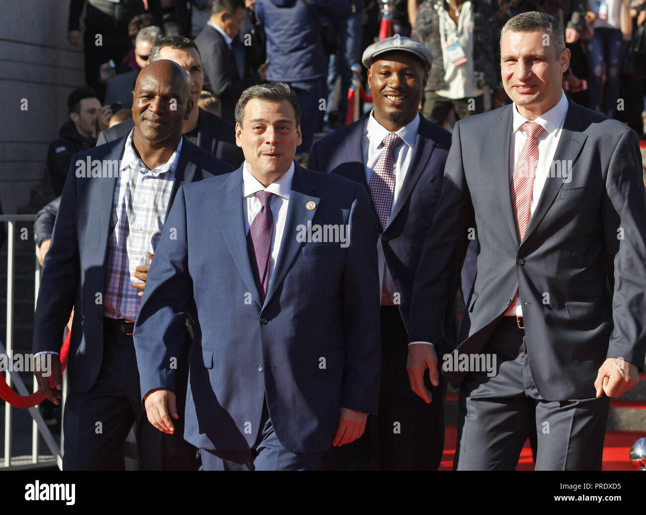 Kiev, Ukraine. 1st Oct, 2018. Evander Holyfield, former Boxing Champion (L), Mauricio Sulaiman, President of the World Boxing Council (WBC) (2-L), Lennox Lewis, former Boxing Champion (2-R) and Vitali Klitschko, former heavyweight boxing champion and current Mayor of Kiev (R) arrive to take part at ceremony of opening of the 56th WBC Convention in Kiev, Ukraine. The 56th WBC Convention in which take part boxing legends Evander Holyfield, Lennox Lewis, Eric Morales and about 700 participants from 160 countries runs in Kiev from September 30 to October 5. (Credit Image: © Pavlo Gonchar/SOPA I Stock Photo