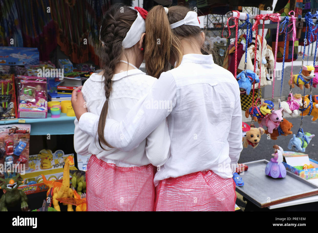 Madeira, Portugal. 20th May, 2018. Two young girls hug during the Onion