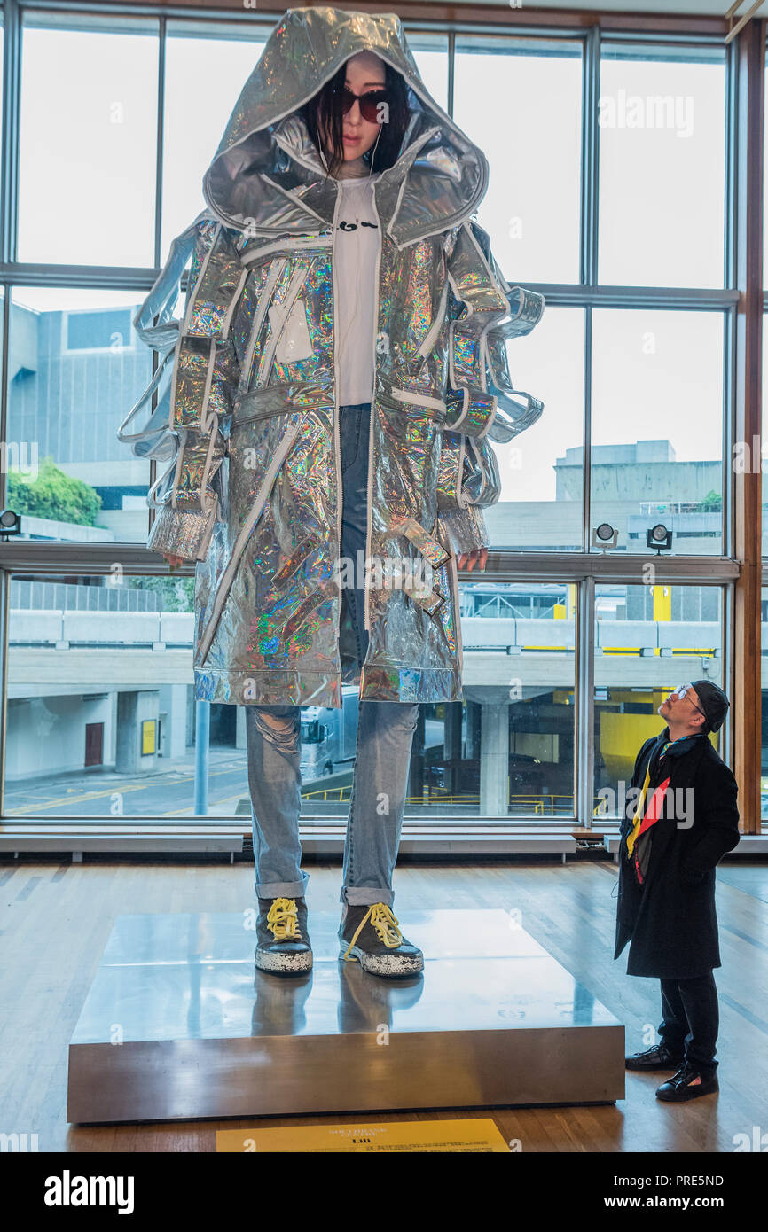 London, UK. 2nd Oct, 2018. Tim Yip with Lili, a large scale art installation which is part of BAFTA and Academy Award Winner art director, Tim Yip’s multifaceted Cloud project especially commissioned for this year’s China Changing Festival. The project also incorporates a fashion show on Sunday 7 October showing 25 specially designed costumes, developed over months of collaboration between some of London’s leading fashion designers and promising most fashion students. Credit: Guy Bell/Alamy Live News Stock Photo
