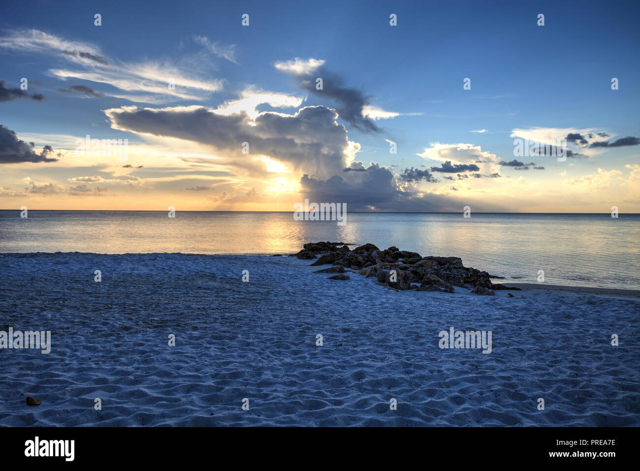 Sunset over the white sand on Naples Beach in Naples, Florida in summer. Stock Photo