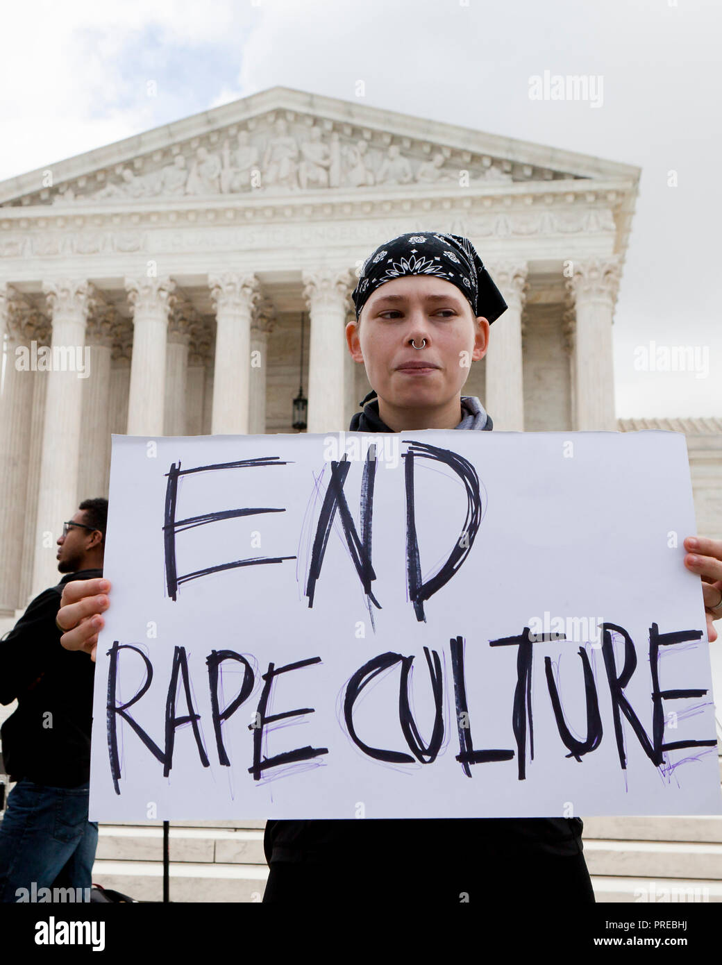 Protester opposing Supreme Court nominee Brett Kavanaugh in front of the US Supreme Court (woman holding End Rape Culture sign) - Washington, DC USA Stock Photo