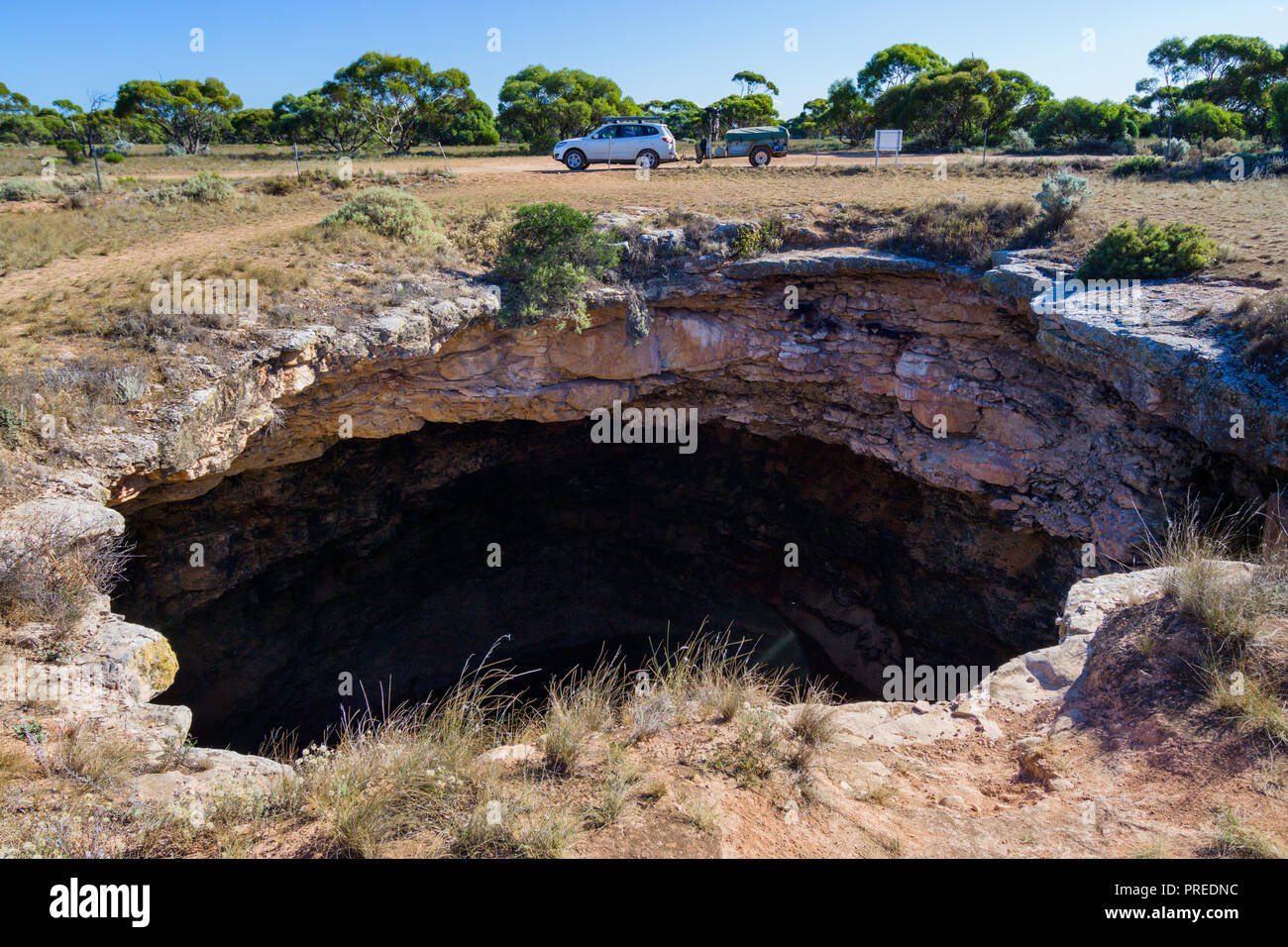 The opening to Murra-el-Elevyn Cave on the Nullabor Plain near Cocklebiddy Western Autralia Stock Photo
