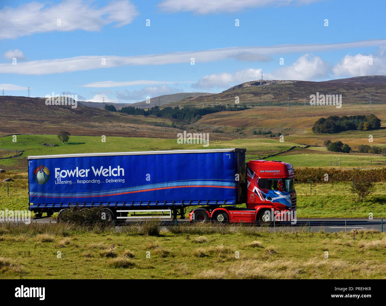 Fowler Welch Listening...Responding...Delivering HGV. JHP Transport Lanark. M6 Northbound carriageway, Shap, Cumbria, England, United Kingdom, Europe. Stock Photo
