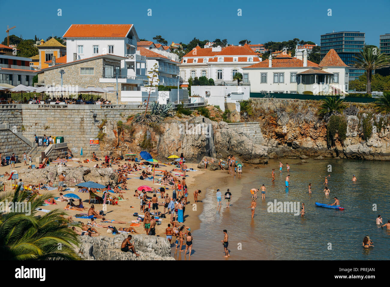 Cascais, Portugal - Sept 29, 2018: People sunbathing on the Praia da Rainha beach in Cascais, Portugal. Cascais is famous and popular summer vacation  Stock Photo