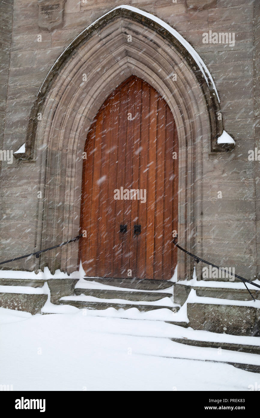 Door of Rhu and Shandon Parish Church in the snow with snow falling. Stock Photo