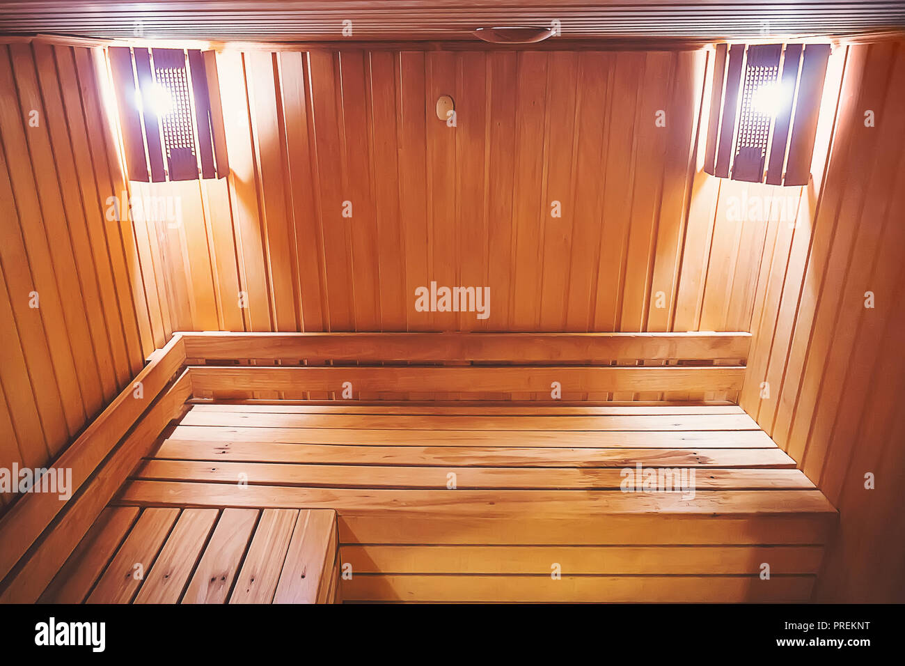 Interior of small home Finnish wooden sauna. Infrared sauna. Cedar bath. benches in hospital recreational room, relaxing leisure in bath-house equipme Stock Photo