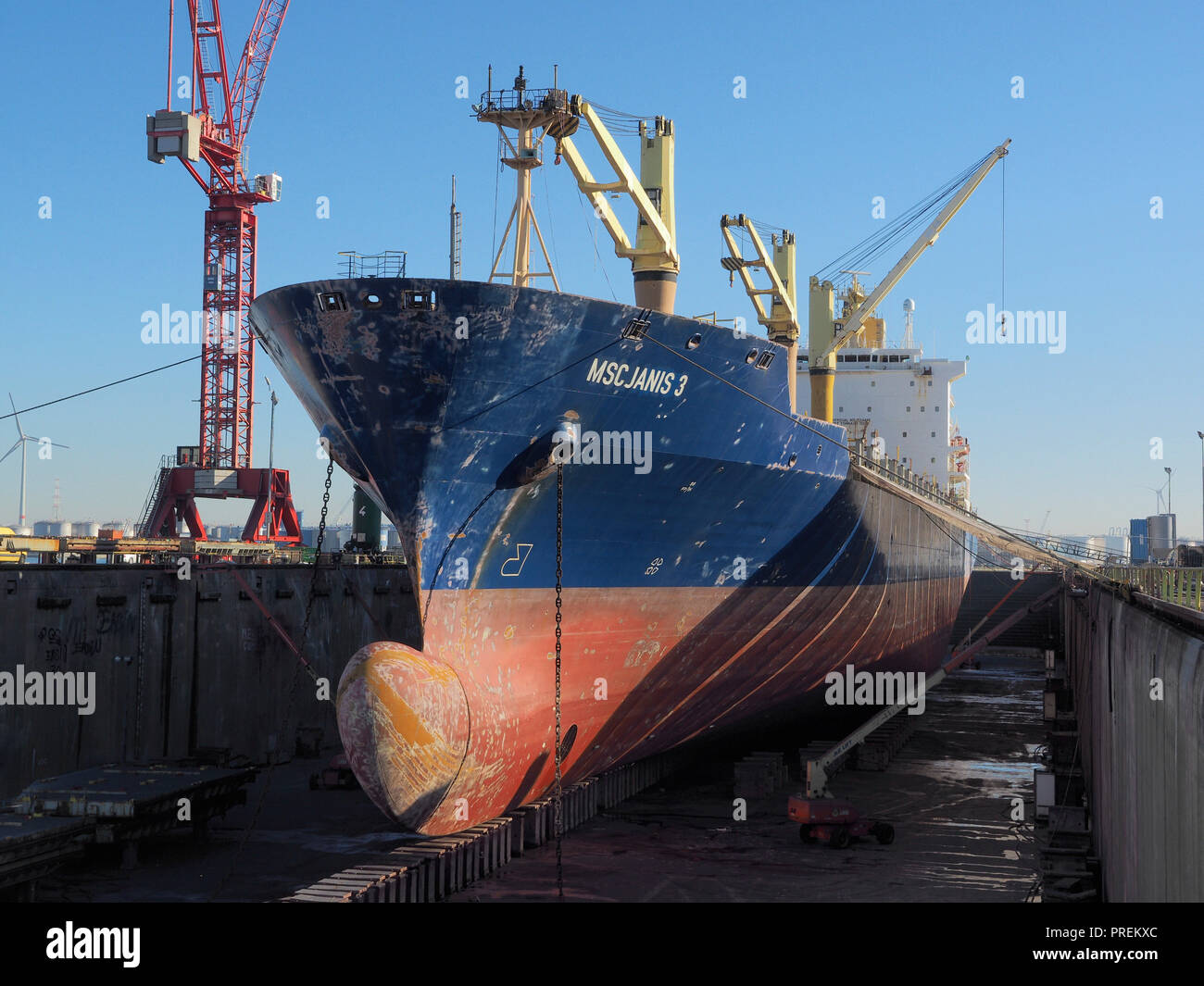 Cargo ship in dry dock for maintenance in the port of Antwerp, Belgium Stock Photo
