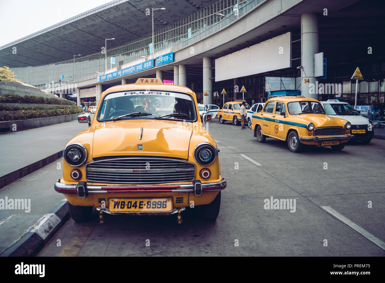 Vintage yellow taxi in the airport Parking lot. KOLKATA, INDIA - 26 January 2018. Stock Photo