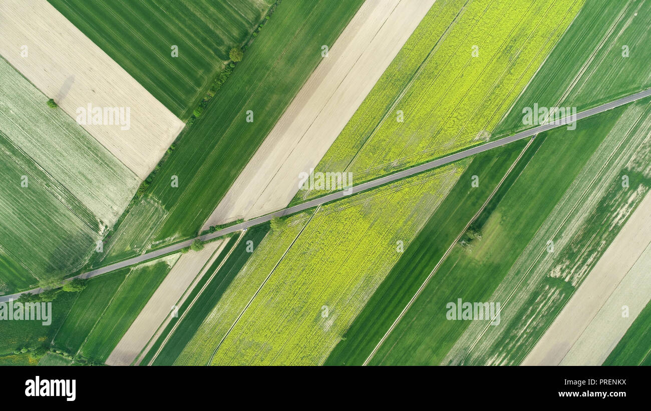 Aerial landscape- road between fields Stock Photo - Alamy