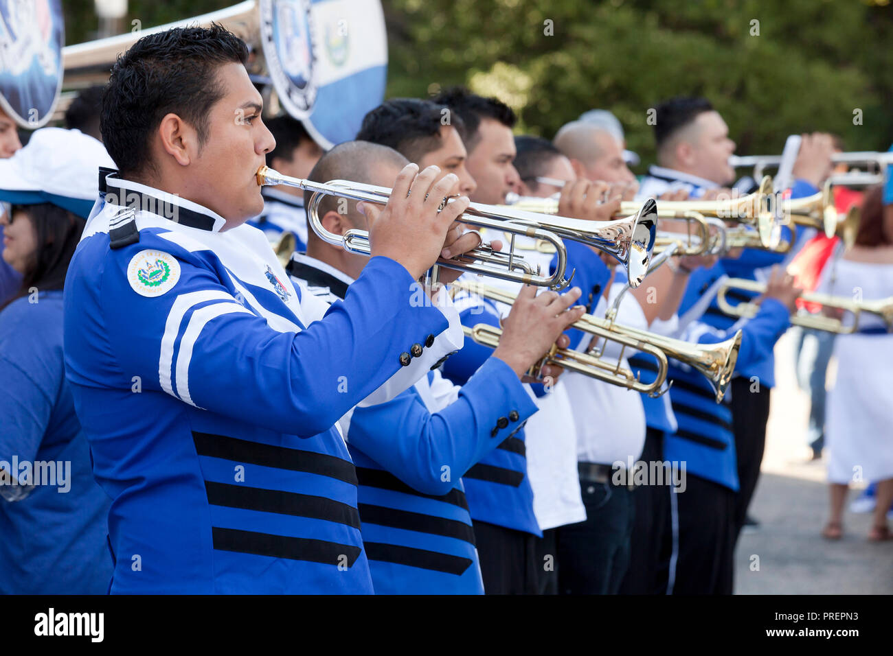 Hispanic (Salvadoran / Salvadorian) trumpet players in marching band - USA Stock Photo