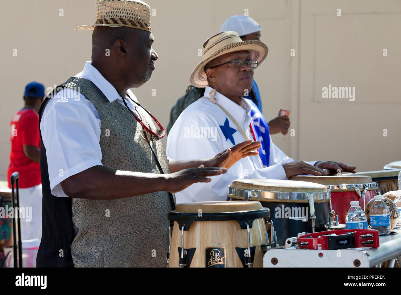 Afro-Panamanian man playing conga drums (tumbadora) during cultural event - USA Stock Photo