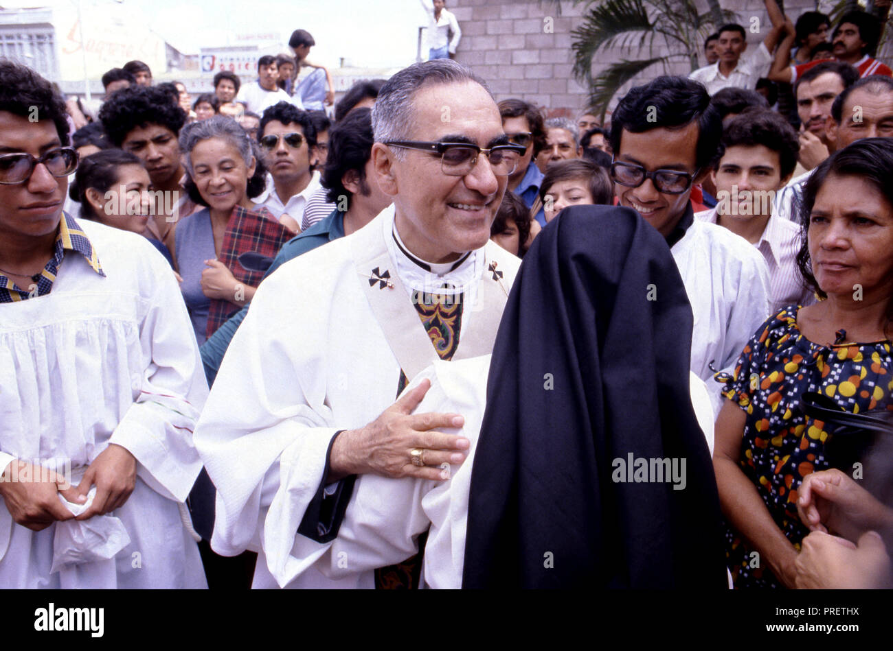 The martyr Archbishop Oscar Romero of El Salvador is greeted by an Catholic nun and several hundred of the faithful after a mass at Iglesia el Rosario -the Church of the Rosary - in San Salvador, El Salvador. The priest was later slain at the alter by a right wing gunman in 1980. Oscar Arnulfo Romero y Galdamez was a bishop of the Catholic Church in El Salvador. He became the fourth Archbishop of San Salvador, succeeding Luis Chavez, and spoke out against poverty, social injustice, assassinations and torture. Romero was assassinated while offering Mass on March 24,1980. Stock Photo
