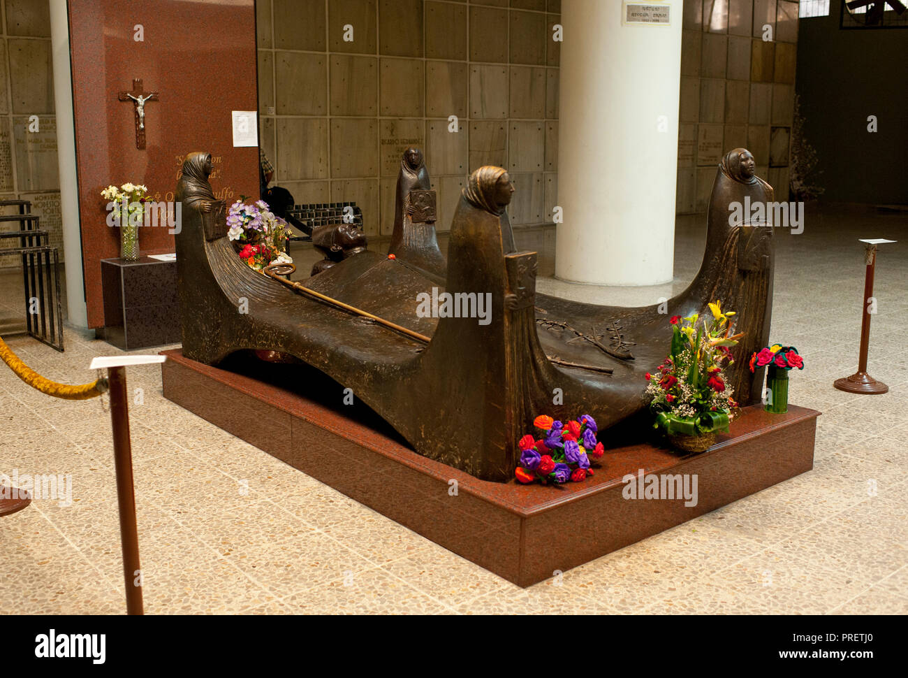 The tomb of Archbishop Oscar Romero of El Salvador at San Salvador's Metropolitan Cathedral. The Archbishop was slain at the alter of his Church of the Divine Providence by a right wing gunman in 1980. ”scar Arnulfo Romero y Gald·mez was a bishop of the Catholic Church in El Salvador. He became the fourth Archbishop of San Salvador, succeeding Luis Ch·vez, and spoke out against poverty, social injustice, assassinations and torture. Romero was assassinated while offering Mass on March 24,1980. - To license this image, click on the shopping cart below - Stock Photo