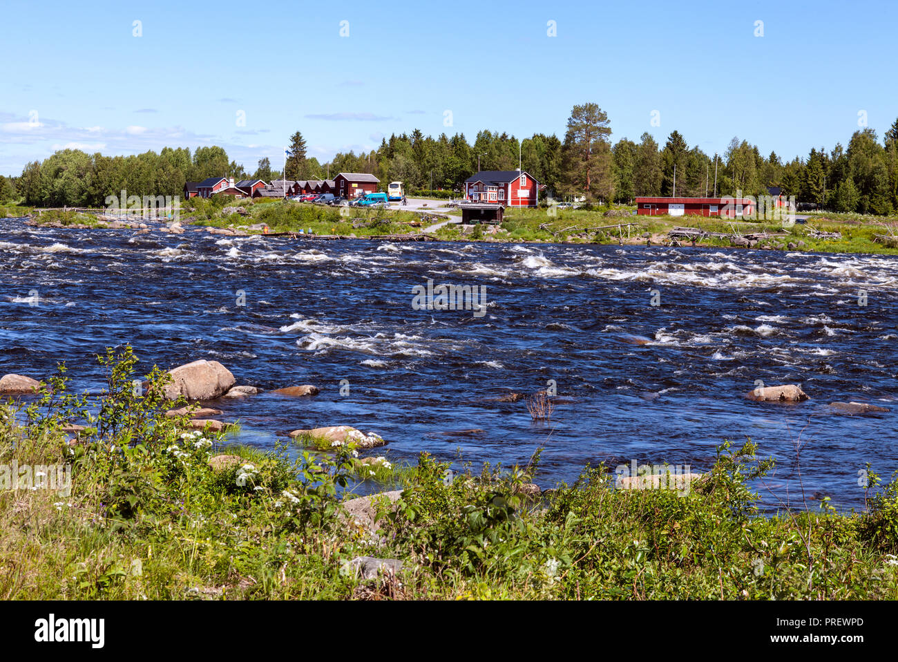 KUKKOLAFORSEN, SWEDEN ON JUNE 27, 2018. View of the river and the Finnish village Kukkola. Buildings and vehicle. Editorial use. Stock Photo