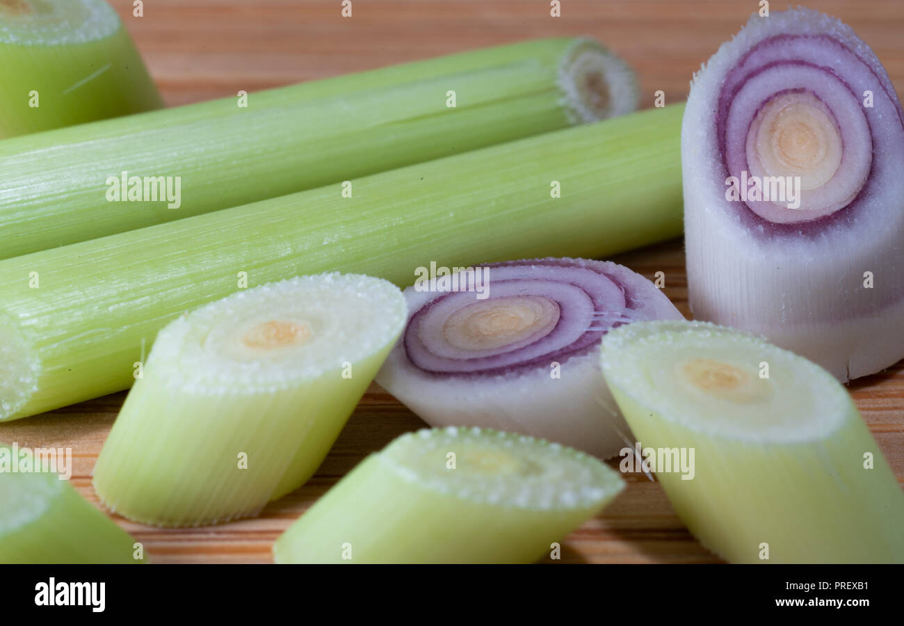 Sliced lemongrass stem on wooden background macro shot Stock Photo