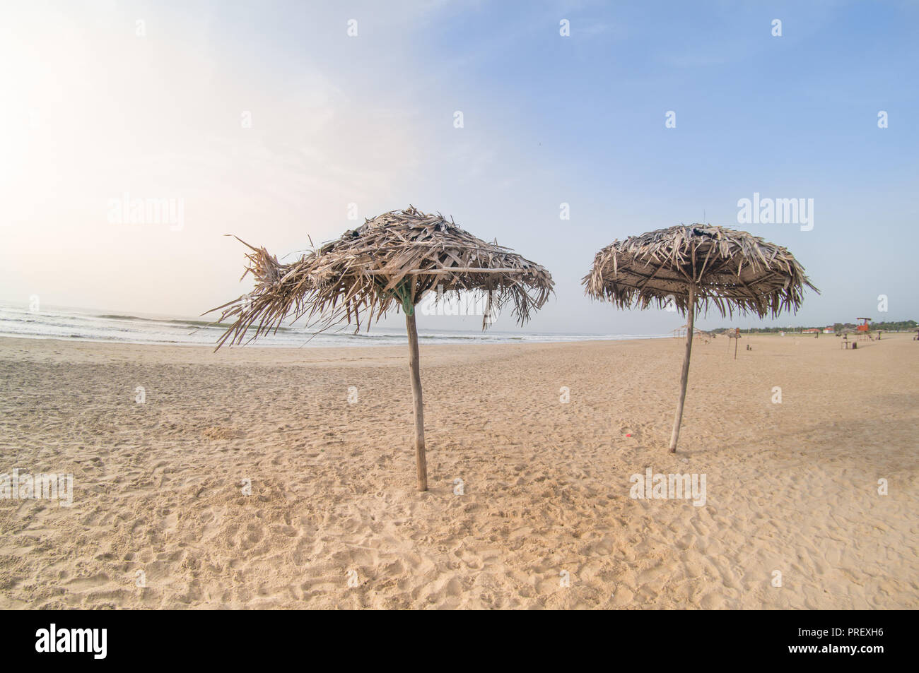 Thatch umbrellas on paradise beach in pondicherry chennai Stock