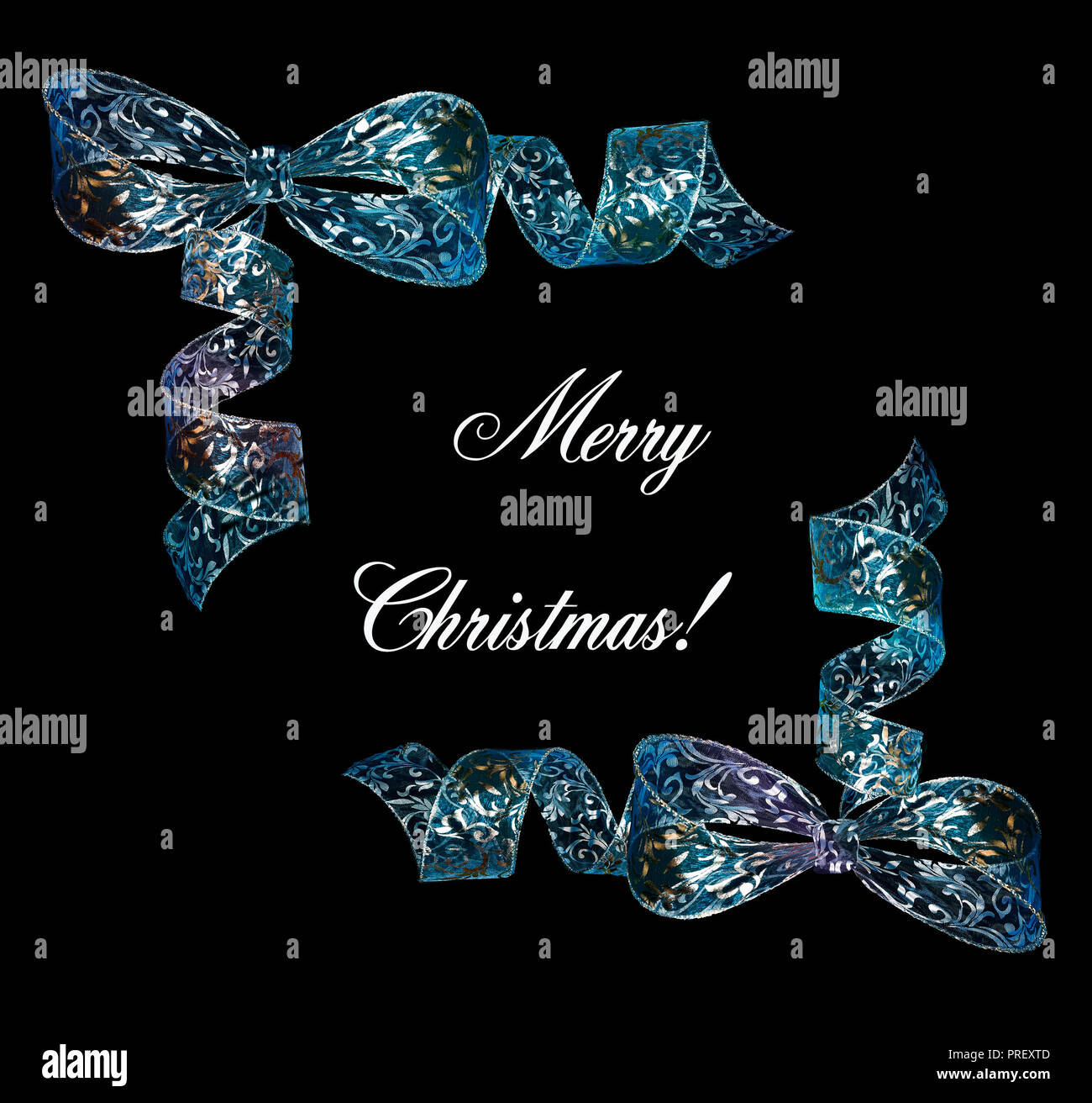 Elegant Christmas background or frame with silver-blue shining bows and white text Merry Christmas on black backdrop Stock Photo
