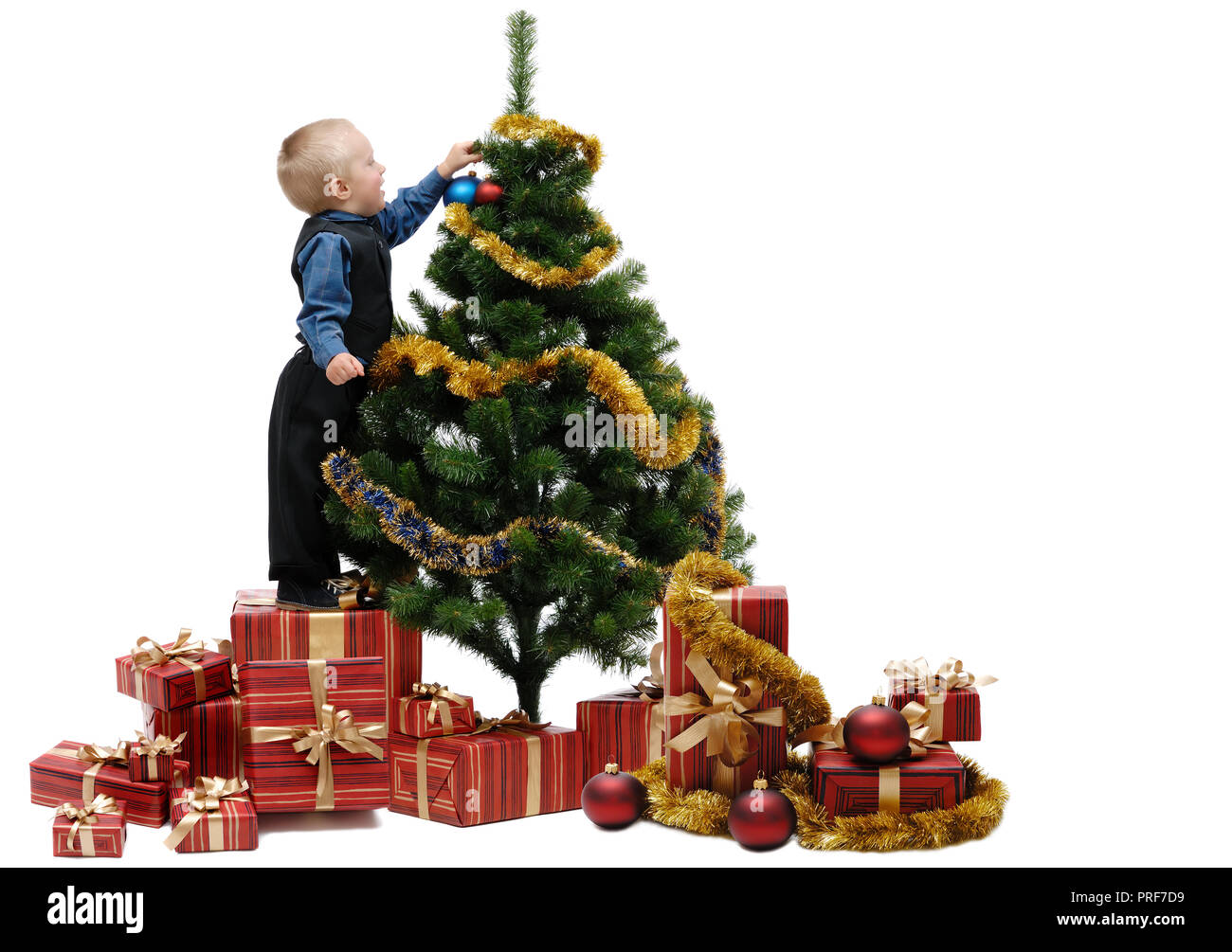 Little boy with Christmas tree on white background, isolated Stock Photo