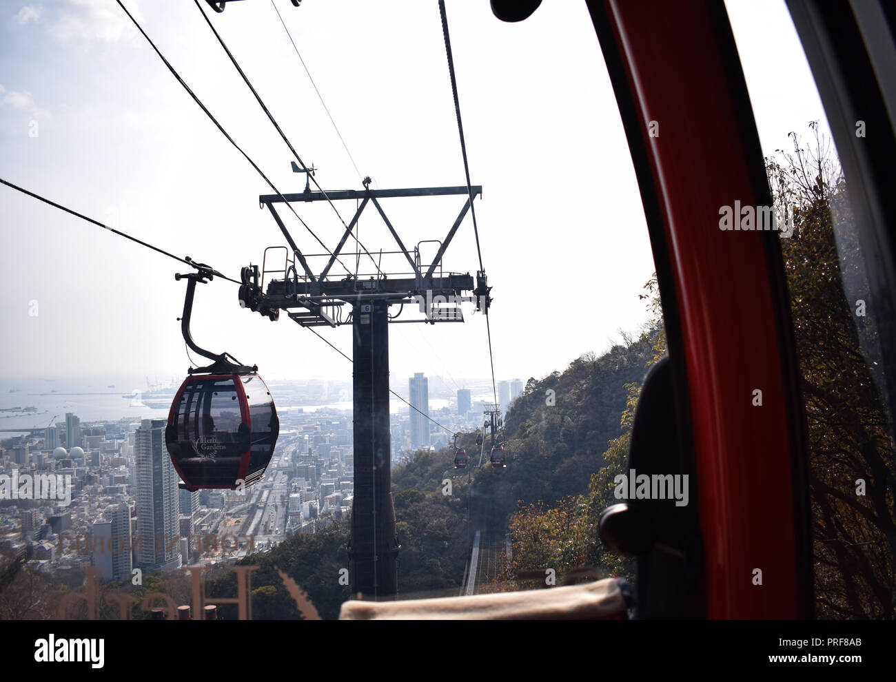 Kobe japan skyline sea visible from inside cable car ride hires stock