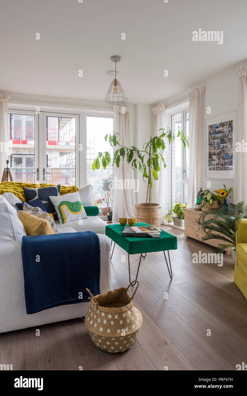 Upholstered sofa and armchair in London apartment Stock Photo