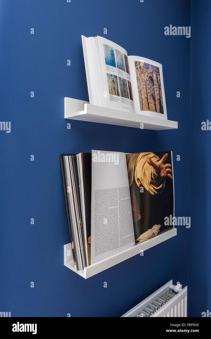 Books on wall mounted reading stands hires stock photography and