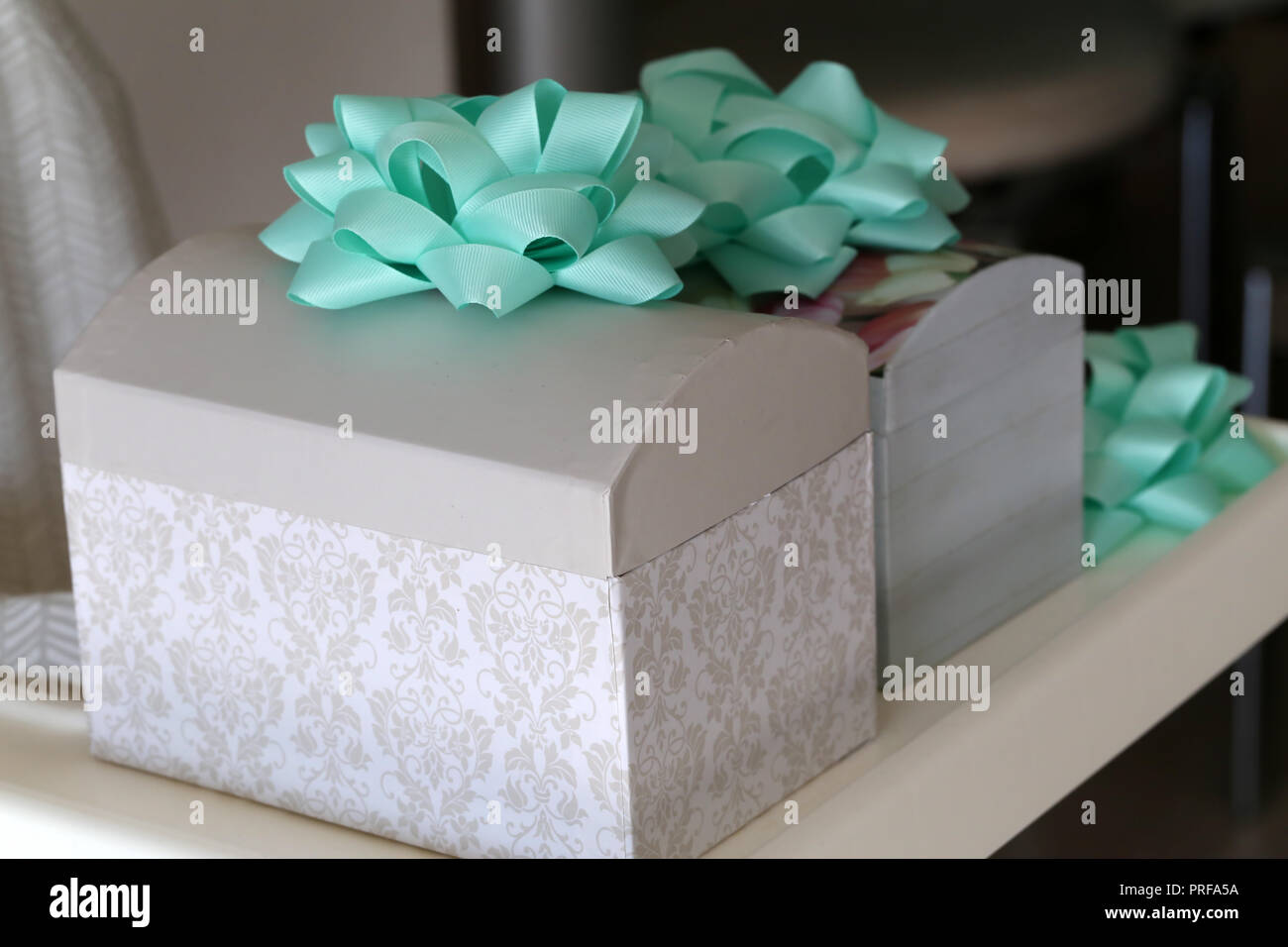 Beautiful homemade caskets stand on the table. Caskets for storing jewelry. Stock Photo
