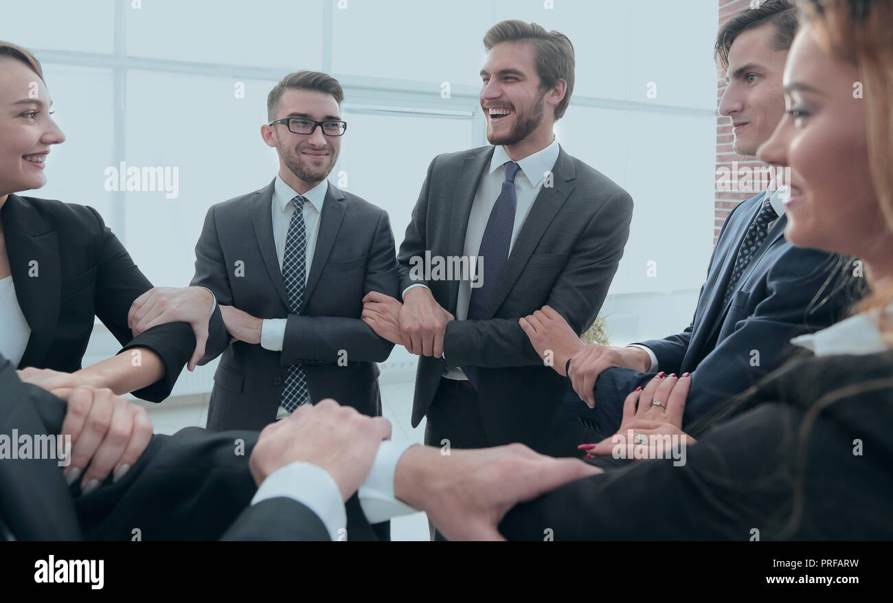 closeup. business team showing their unity Stock Photo - Alamy