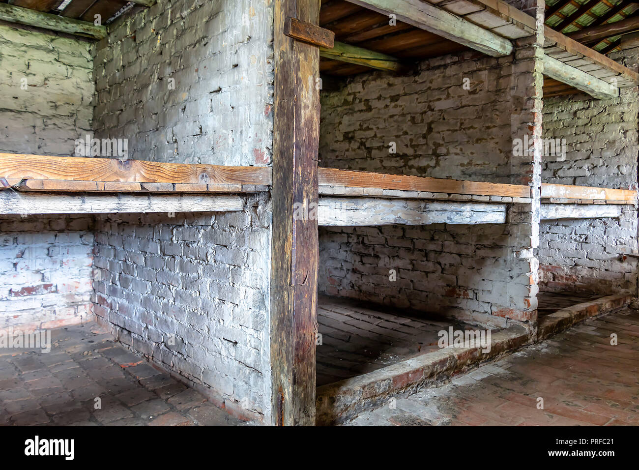 Prisoner's beds, bunks inside barrack in Auschwitz Birkenau. Nazi concentration camp Auschwitz II, Auschwitz Birkenau, Poland Stock Photo