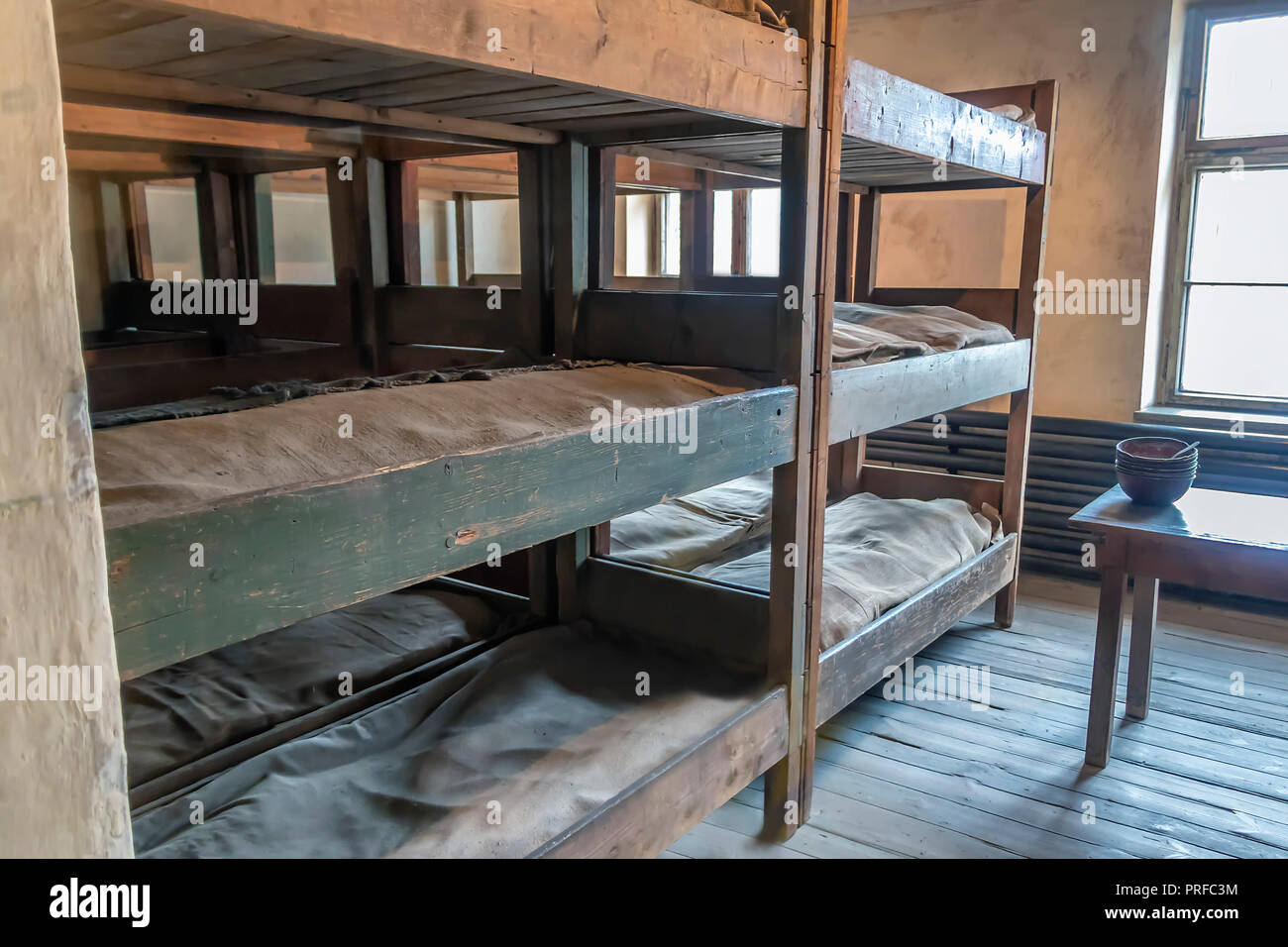 Women's Prisoners beds, bunks inside barrack in Auschwitz I, Nazi concentration camp built and operated by the Third Reich in Poland Stock Photo