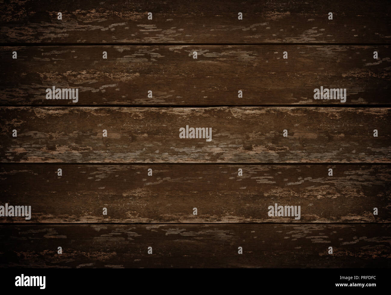 A dark and rustic wood table background, top down view. Stock Photo