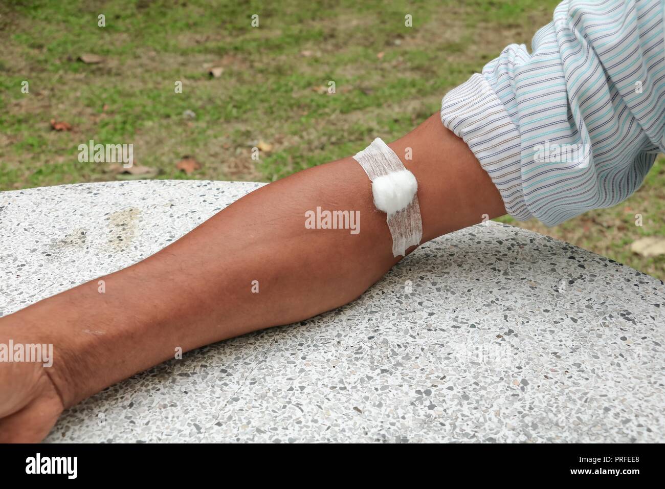Bandage and gauze on an arm after a blood test Select focus with