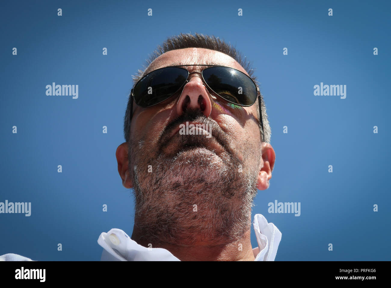 Headshot portrait of tanned middle aged man Stock Photo