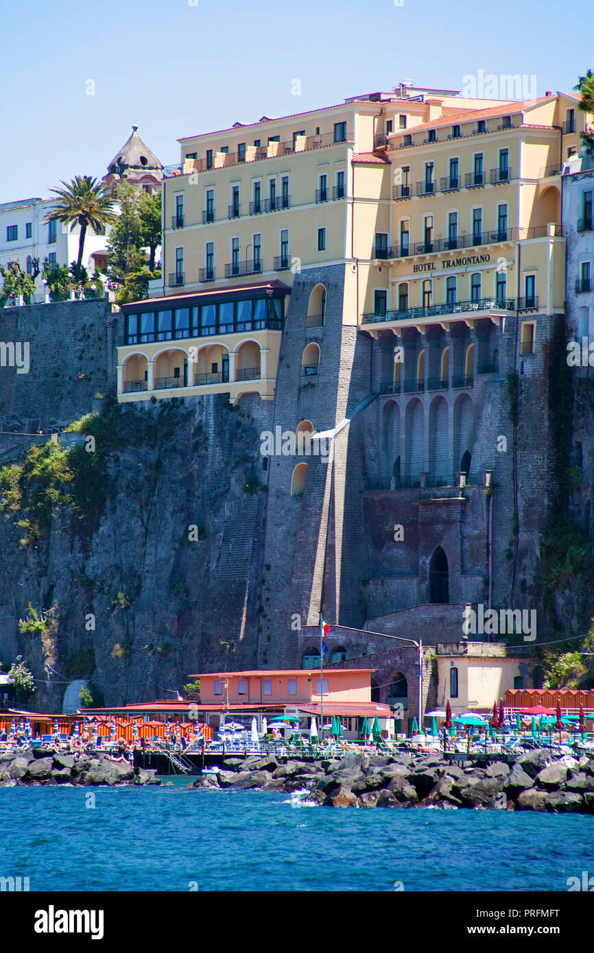 Narrow bathing beach and hotels on the cliff, Sorrento, Peninsula of Sorrento, Gulf of Naples, Campania, Italy Stock Photo