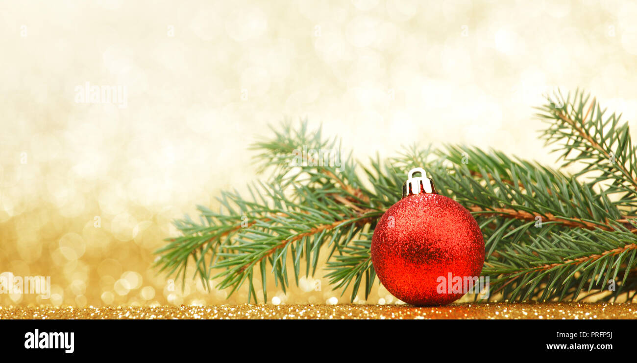 Christmas card with fir and ball on glitter background Stock Photo - Alamy