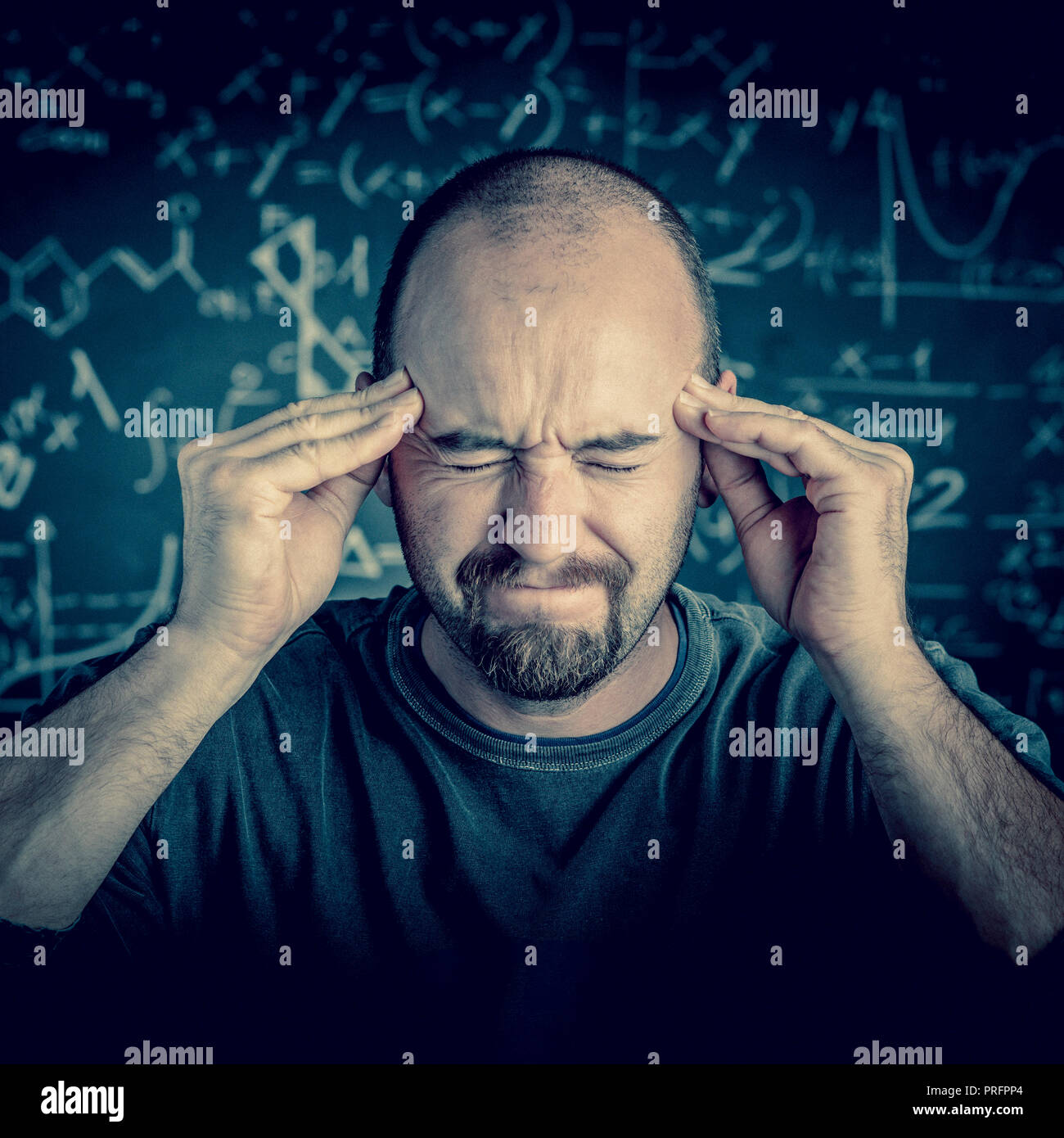 stressed teacher and blackboard background Stock Photo