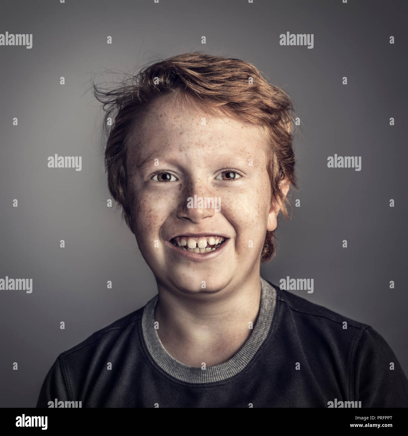 smiling young boy studio portrait Stock Photo