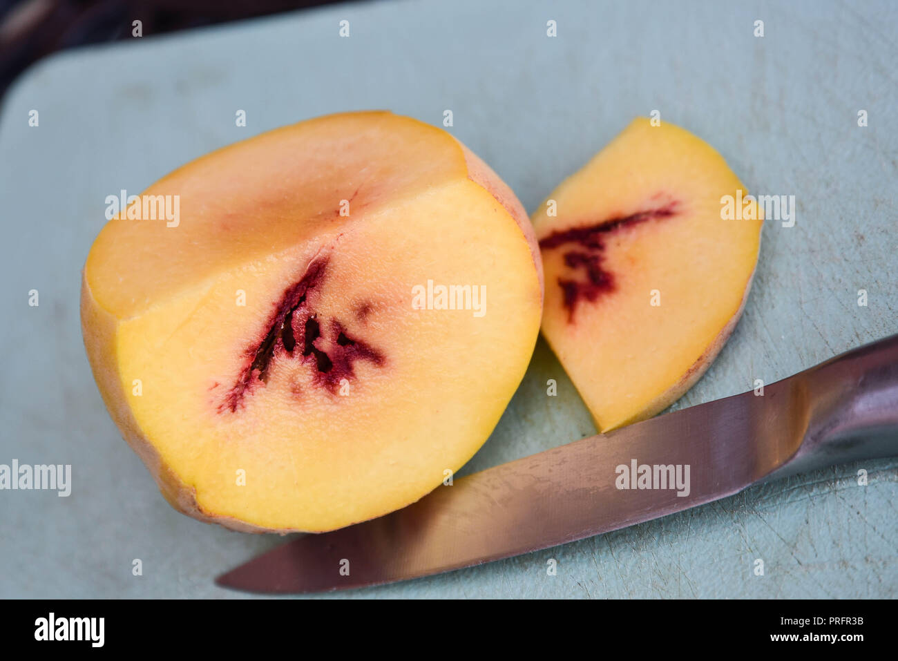 peack sliced on a board Stock Photo