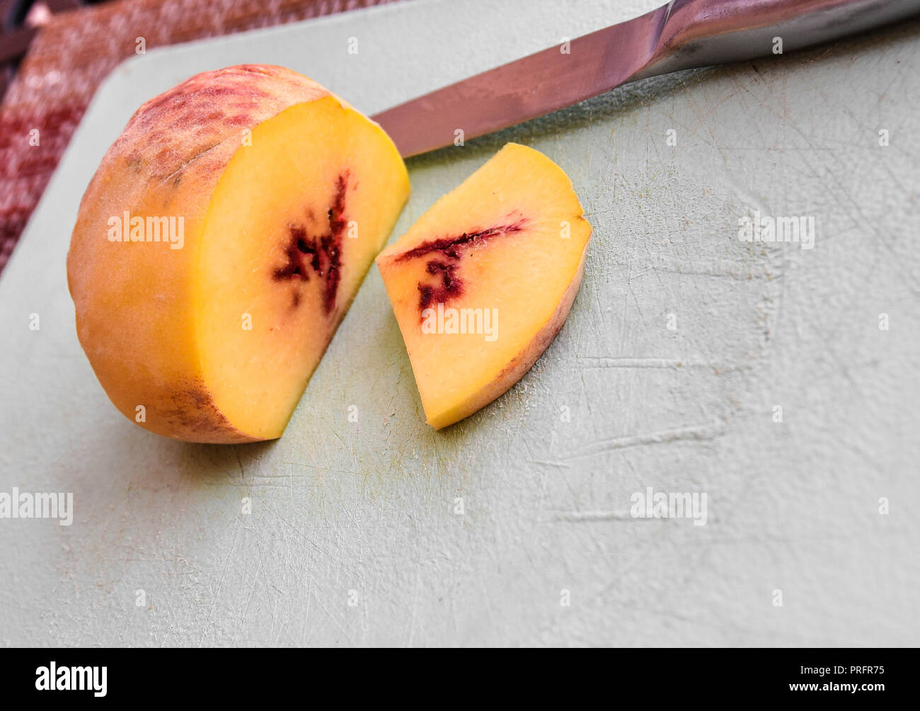 peack sliced on a board Stock Photo