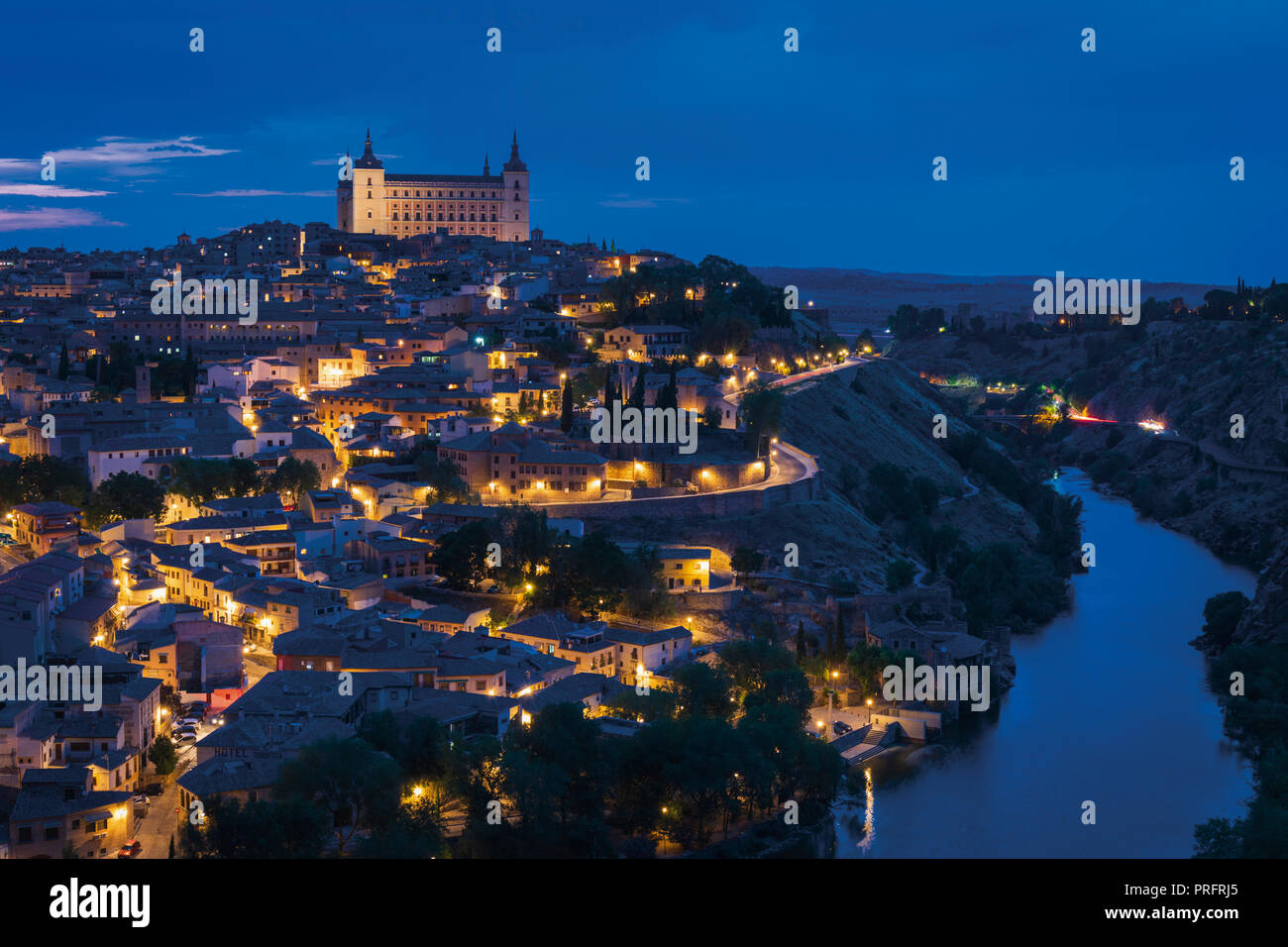 Toledo, Toledo Province, Castilla-La Mancha Spain.  Overall view of the historic centre showing the Tagus River (Rio Tajo) and the Alcazar.  Toledo is Stock Photo