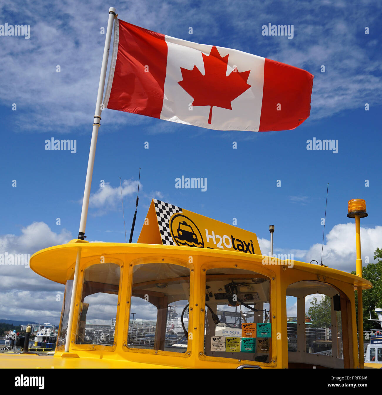 Harbour ferry and Canadian Flag , Inner Harbour, Victoria, Vancouver Island. Stock Photo