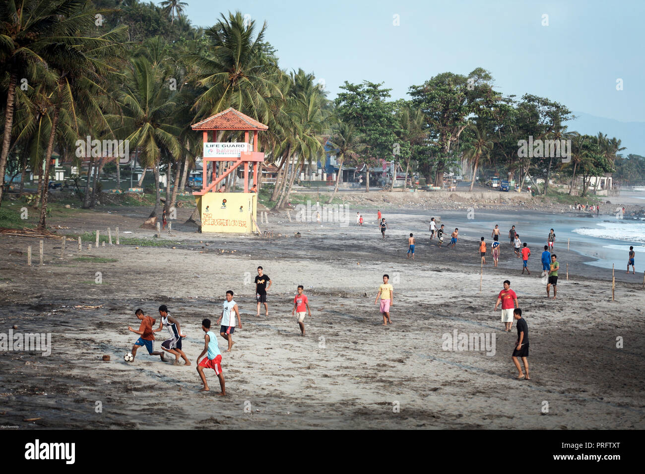 Javanese boys playing games of football on the beach in Karanghawu