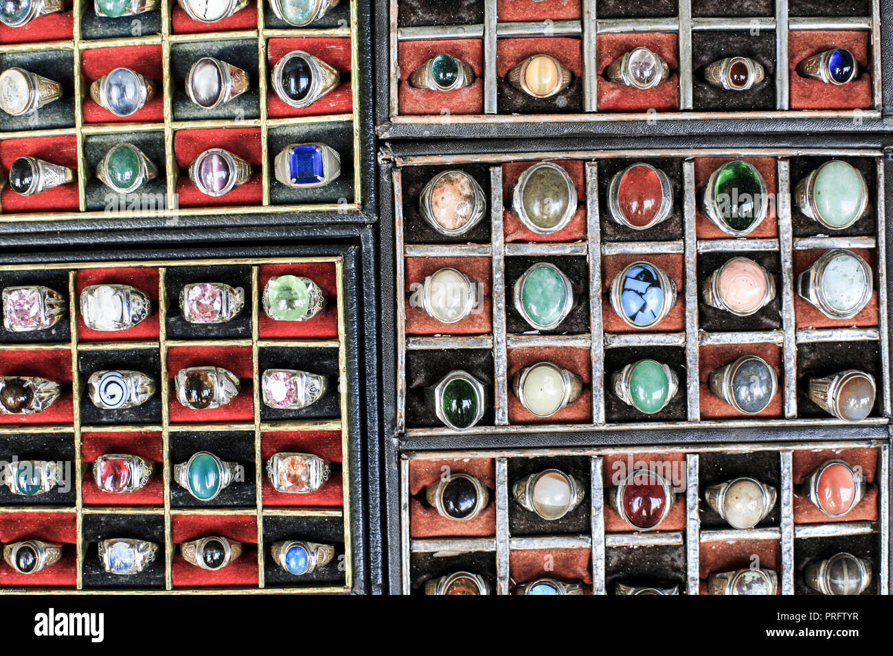 Rings with semi precious gemstones for sale by street vendor in Jakarta, Java, Indonesia Stock Photo
